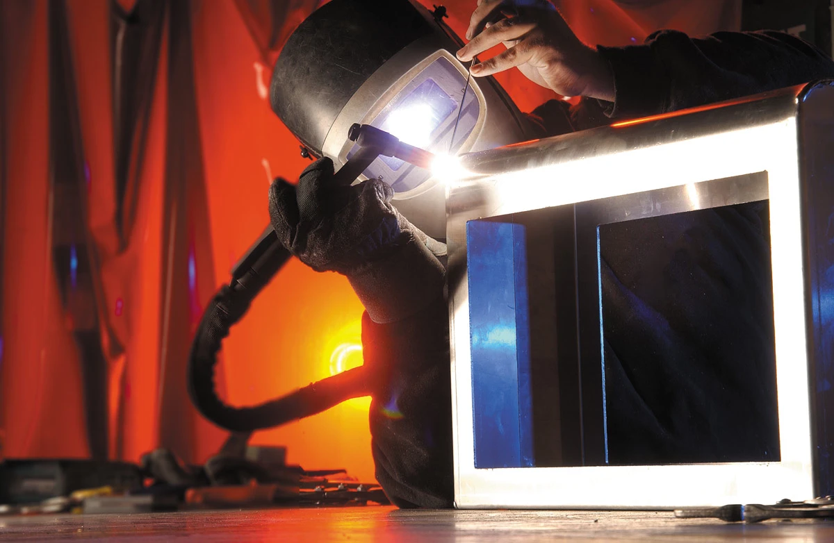 Sign welding in progress at the Brand Consortia factory